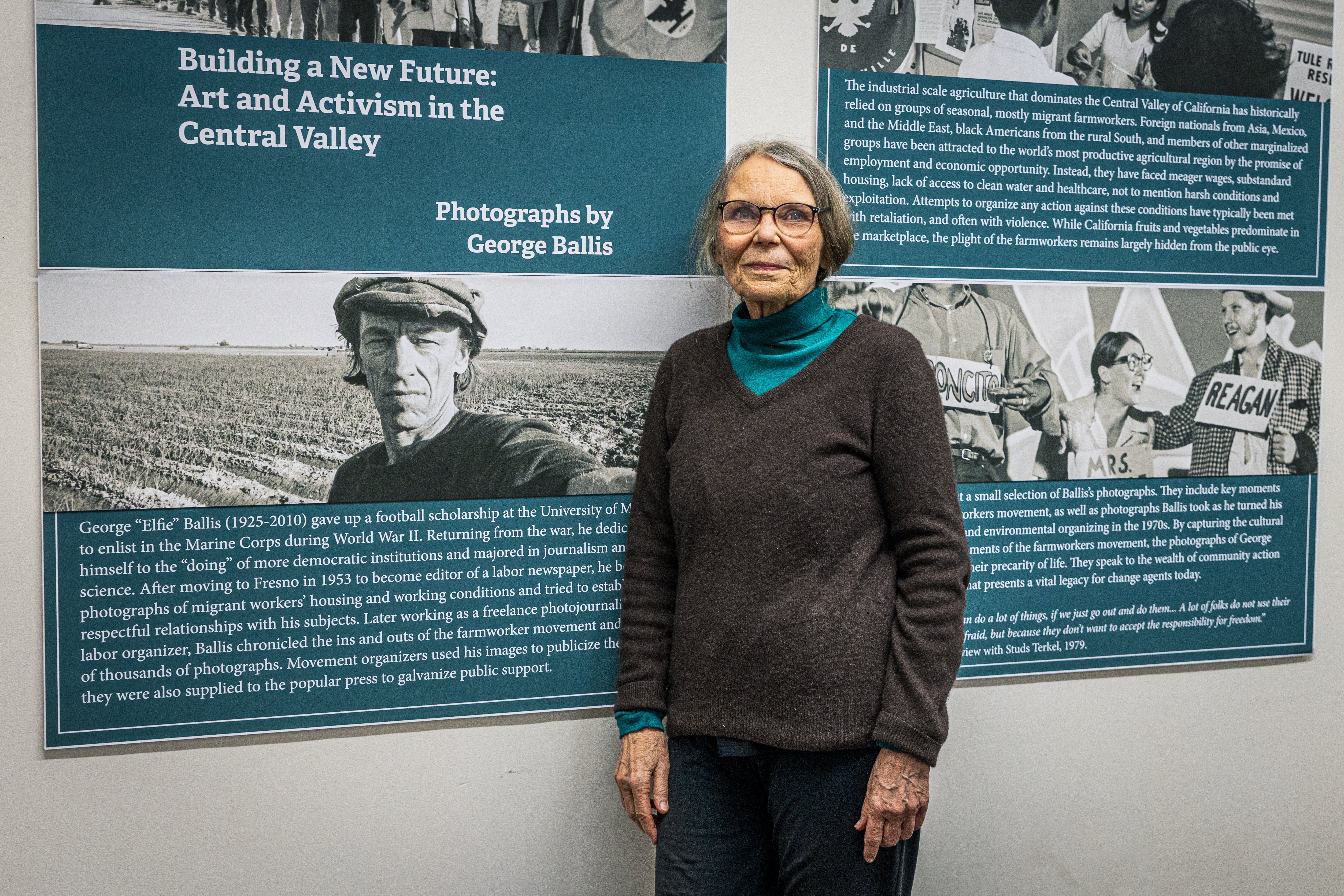 Maia Ballis stands in front of exhibit