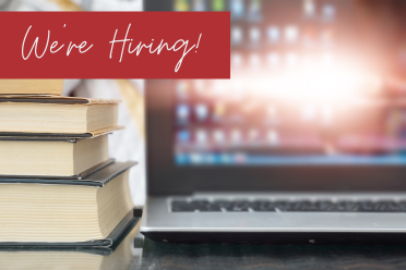 We're hiring in white script lettering on red banner. Banner is on images of three stacks books with close up of laptop at right. 