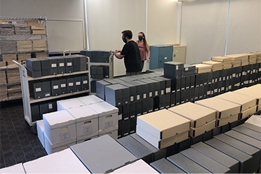 Library staff moving collections into the building