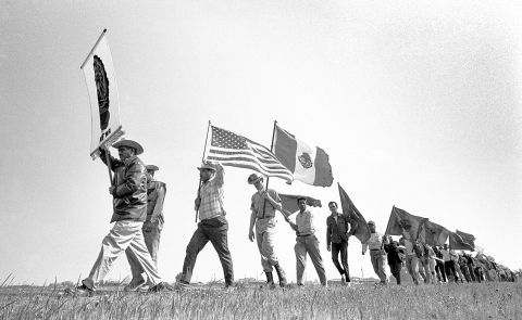 Farm workers march north of Merced, AWOC & NFWA march from Delano to Sacramento. Photography by George Ballis.