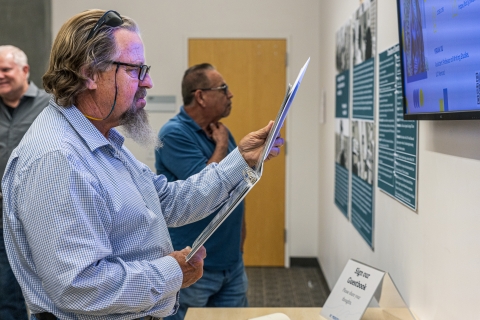 John Ballis looks at contact sheets