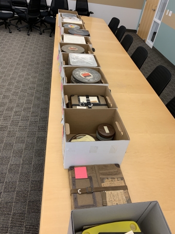 Boxes of film reels from the University of California Division of Agriculture and Natural Resources, UC Cooperative Extension Records.